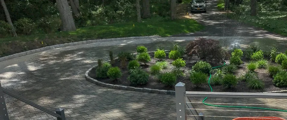 Circular paver driveway with center landscaping.