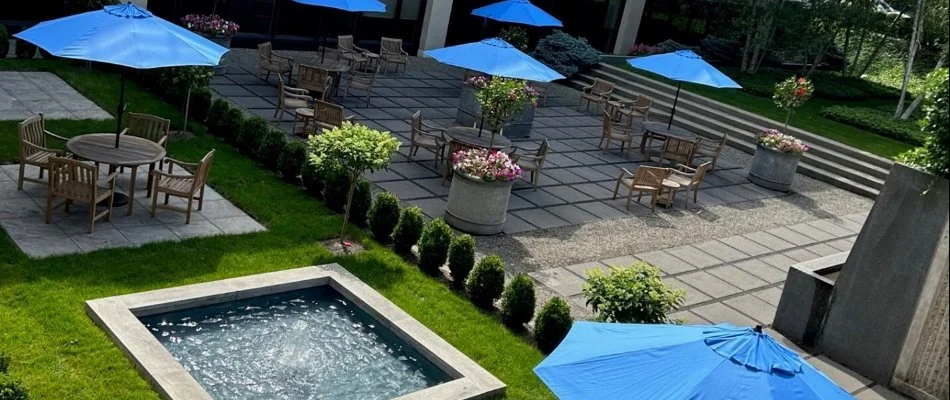 Courtyard in White Plains, NY, with a patio and landscaping.