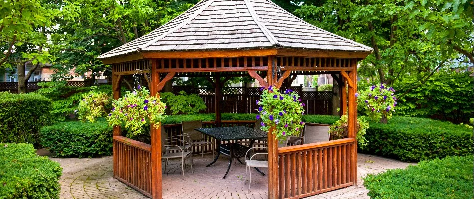 Wooden gazebo with furniture underneath it in White Plains, NY.