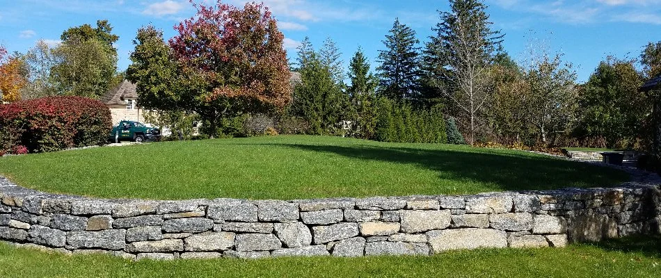 Lawn and stone retaining wall in White Plains, NY.