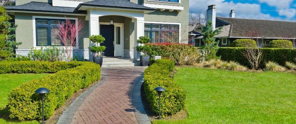 Walkway leading up to a house on a property in White Plains, NY.